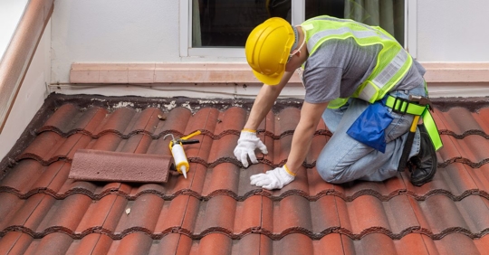 roofer performing maintenance