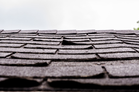 damaged asphalt shingles